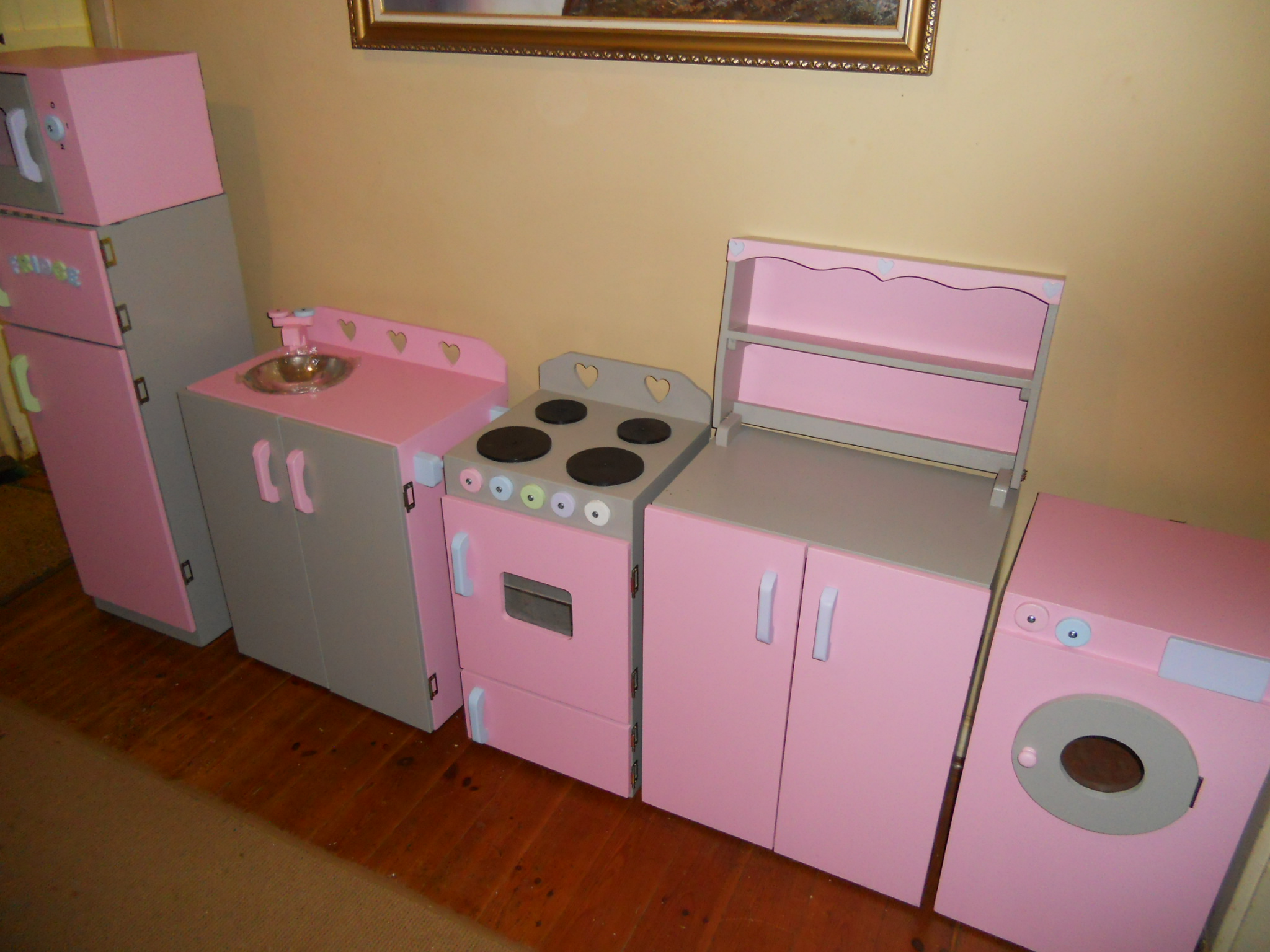 Fridge, sink,stove, dresser, washing machine and microwave painted in Grey and pink